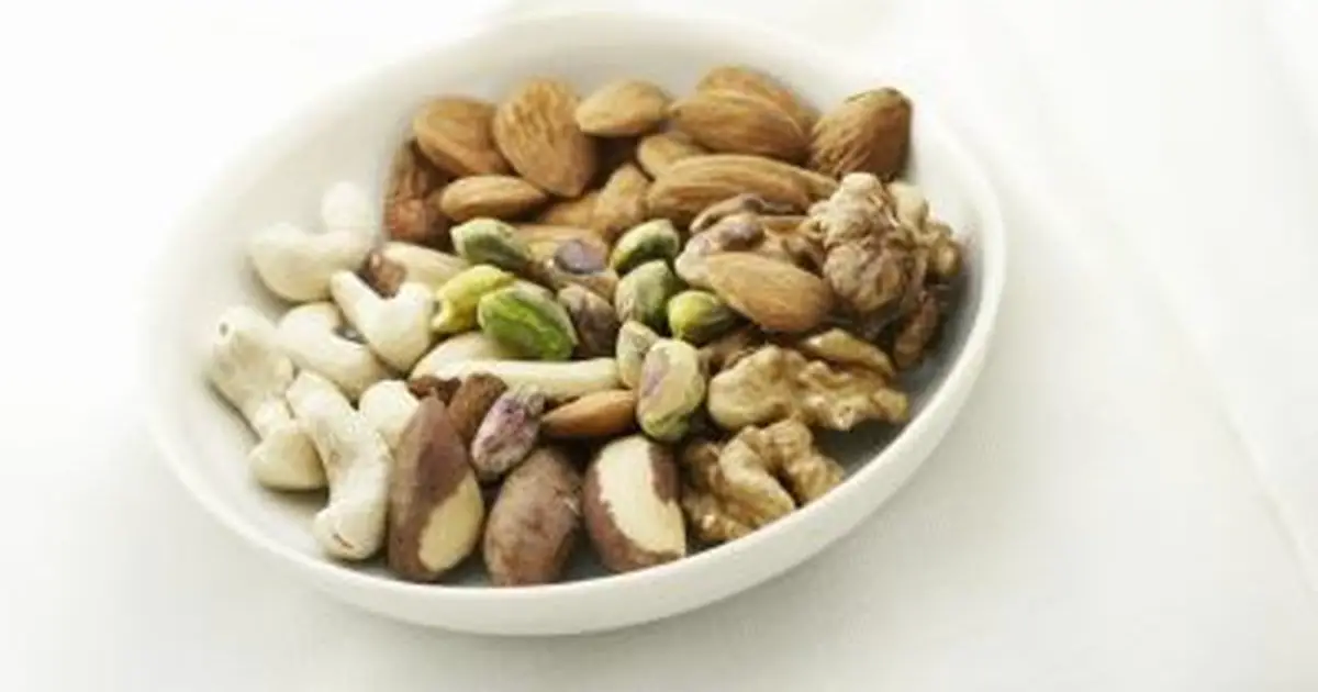 What Vitamins &  Minerals Do Nuts Contain?